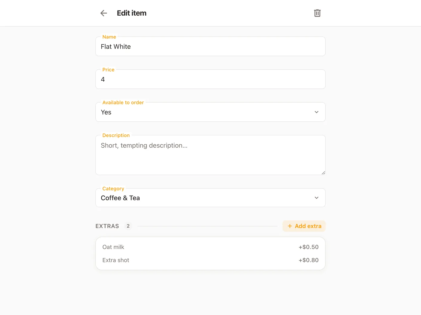 A menu item open in Platevio: the Flat White’s name and price, Available to order set to Yes, an empty description, its category, and its two extras, Oat milk and Extra shot