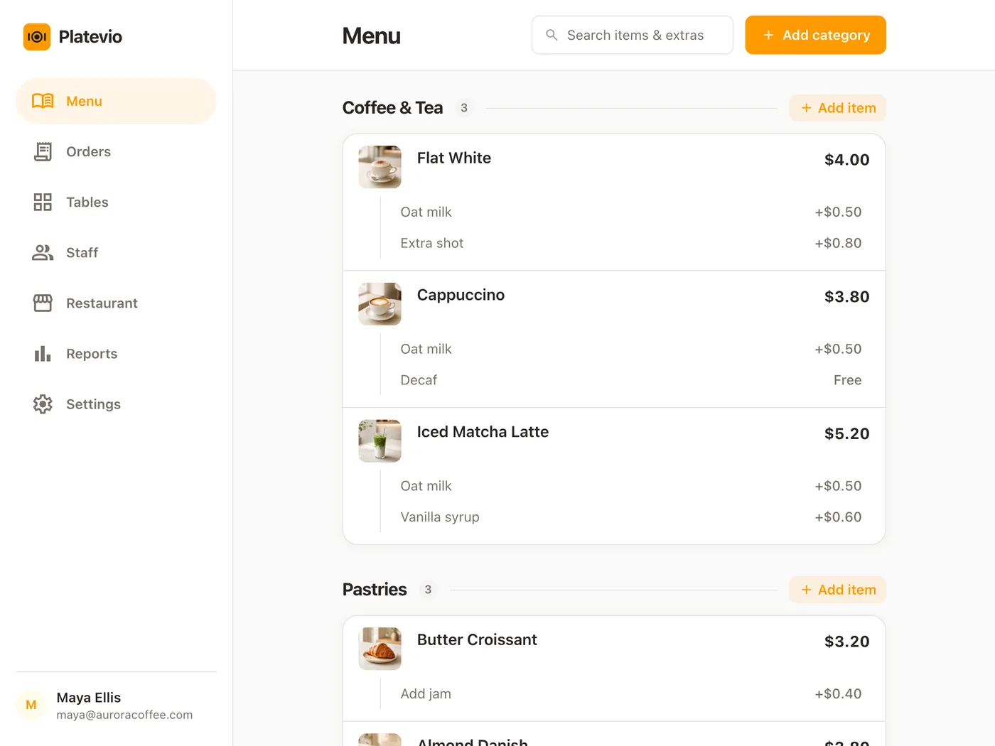 A cafe menu open in Platevio on a counter tablet, with photos, prices and extras