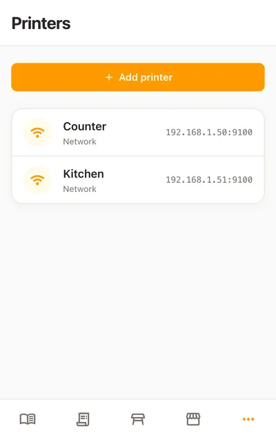 The same Printers list on a phone: the counter’s printer and the kitchen’s, each with a network glyph and its address