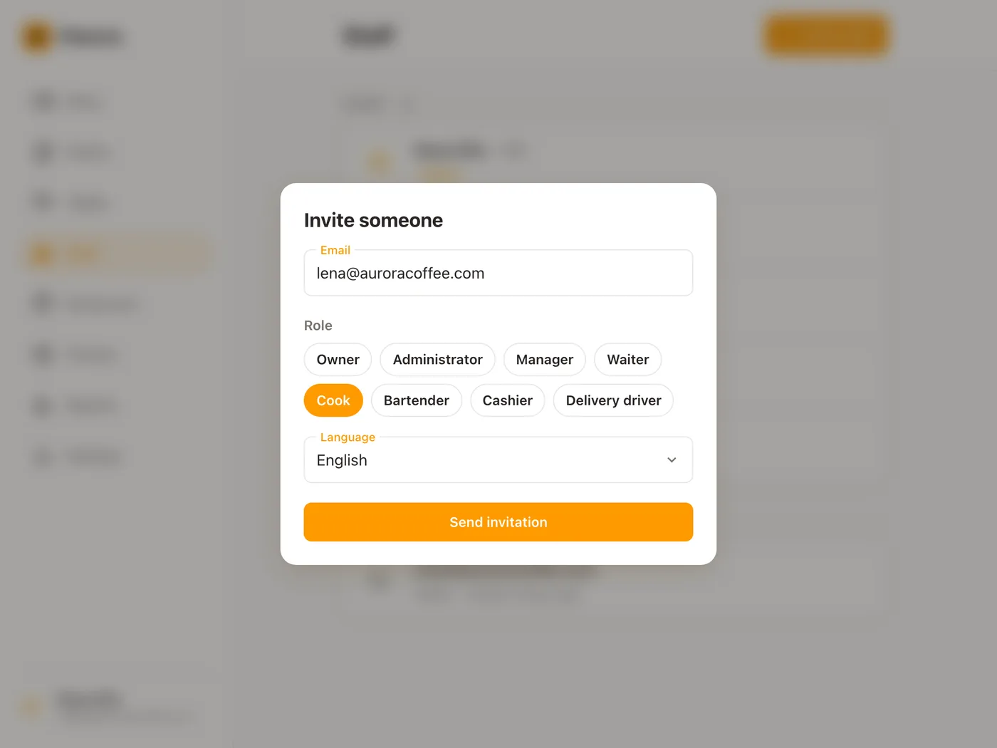 Inviting a new cook: the Invite someone dialog over the Staff page, with lena@auroracoffee.com typed in, Cook chosen from the Role pills and the language of the invitation set